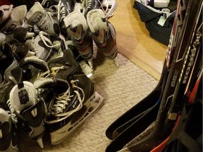 Donated hockey equipment is shown in Vancouver high school hockey coach Todd Hickling's basement.