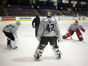 File: Team Canada goalies from left, Michael DiPietro, Ian Scott and Matthew Villalta warm up with goaltending consultant Fred Brathwaite during selection camp at the Q Centre in Victoria, B.C., on Tuesday, December 11, 2018.