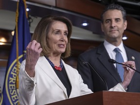 House Minority Leader Nancy Pelosi, D-Calif., is joined by Rep. John Sarbanes, D-Md., to discuss their priorities when they assume the majority in the 116th Congress in January, at the Capitol in Washington.