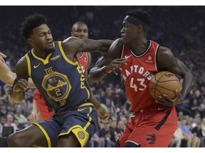 Toronto Raptors forward Pascal Siakam (43) drives to the basket against Golden State Warriors forward Jordan Bell (2) during the first half of an NBA basketball game in Oakland, Calif., Wednesday, Dec. 12, 2018.