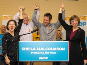 NDP MLAs Selina Robinson (left to right), Scott Fraser and Rob Fleming celebrate Sheila Malcolmson's nomination as the NDP candidate in the upcoming byelection for the riding of Nanaimo. [PNG Merlin Archive]