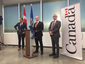Edmonton-Centre MP, Randy Boissonnault (centre) is flanked by Natural Resources Minister Amarjeet Sohi (left) and International Trade Diversification Minister Jim Carr at a Tuesday press conference at NAIT campus in downtown Edmonton. (Photo by Emma Graney/Postmedia)
