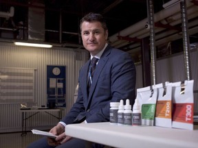 Tilray President Brendan Kennedy is photographed with some of the Tilray product line such as capsules, oils, and dried marijuana at head office in Nanaimo, B.C., on Thursday, Nov. 29, 2017.