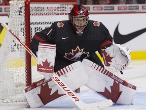 Team Canada goalie Michael DiPietro keeps an eye on the puck during play against Team Czech Republic in the third period of a 2019 IIHF World Junior Championship hockey game at Rogers Arena, Vancouver, on Dec. 29, 2018.