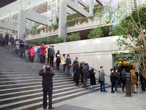 People line up outside the bail hearing of Huawei Technologies Chief Financial Officer Meng Wanzhou at British Columbia Superior Courts on Dec. 10, 2018.