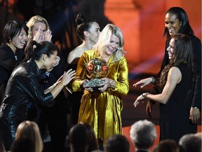 Olympique Lyonnais' Norwegian forward Ada Hegerberg (centre) is congratulated by her teammates after receiving the 2018 FIFA Women's Ballon d'Or award for best player of the year in Paris. Croatia's Luka Modric took the men's prize, topping perennial winners Ronaldo and Lionel Messi among others.