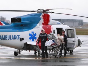 File photo of BC Ambulance Service personal at the Vancouver International Airport.