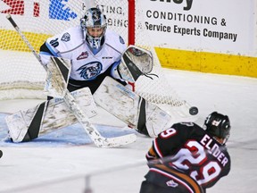 The Calgary Hitmen's Kaden Elder fires a shot on Kootenay Ice goaltender Duncan McGovern during WHL hockey action at the Scotiabank Saddledome in Calgary on Sunday, November 11, 2018. The Ice are rumoured to be on the move to Winnipeg. Gavin Young/Postmedia