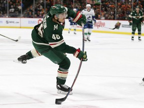 Minnesota Wild defenceman Jared Spurgeon shoots on the Vancouver Canucks' goal during an NHL game Nov. 15 in St. Paul, Minn.