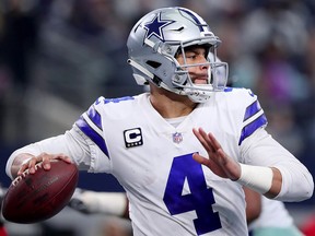 Dak Prescott of the Dallas Cowboys looks for an open receiver against the Tampa Bay Buccaneers in the fourth quarter at AT&T Stadium on Dec. 23, 2018 in Arlington, Texas.