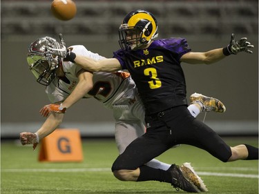 VANCOUVER December 01 2018.   New Westminster Hyacks #15 Austin Galbraith and Mount Douglas Rams #3 Sam Mosky reach for a pass intended for Mosky in the AAA final of the BC high school football championships at the Subway Bowl 2018, BC Place, Vancouver,  December 01 2018.   Gerry Kahrmann  /  PNG staff photo) 00055454B [PNG Merlin Archive]