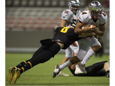 VANCOUVER December 01 2018.    Mount Douglas Rams #8 Sebastian Hansen launches himself at New Westminster Hyacks #4 Kinsale Phillip in the AAA final of the BC high school football championships at the Subway Bowl 2018, BC Place, Vancouver,  December 01 2018.   Gerry Kahrmann  /  PNG staff photo) 00055454B [PNG Merlin Archive]