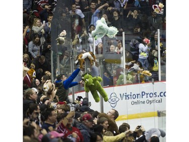 Teddy bears and other stuffed animals are tossed on the ice during the annual Teddy Bear Toss! after the Vancouver Giants score on the Victoria Royals in a regular season WHL hockey game at the Pacific Coliseum, Vancouver,  December 08 2018.