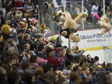 Teddy bears and other stuffed animals are tossed on the ice during the annual Teddy Bear Toss! after the Vancouver Giants score on the Victoria Royals in a regular season WHL hockey game at the Pacific Coliseum, Vancouver,  December 08 2018.