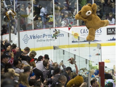 Teddy bears and other stuffed animals are tossed on the ice during the annual Teddy Bear Toss! after the Vancouver Giants score on the Victoria Royals in a regular season WHL hockey game at the Pacific Coliseum, Vancouver,  December 08 2018.