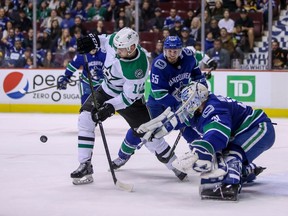 Dallas Stars' Radek Faksa (12) is stopped by Vancouver Canucks goaltender Anders Nilsson (31) during first period NHL hockey action in Vancouver on Saturday, Dec. 1, 2018.