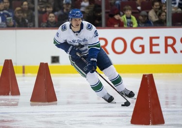 Antoine Roussel #26 of the Vancouver Canucks skates with the puck during the relay race during the Vancouver Canucks Super Skills Contest at Rogers Arena in Vancouver, BC, December, 2, 2018.