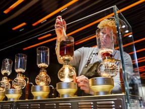 A barista prepares specialty coffee drinks at an espresso bar during a media preview day at the Starbucks Corp. Reserve Roastery in New York.