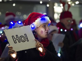 The Impromptu Rock Choir sings a christmas carol during Vancouver's first street carolling competition, the Yule Duel, held in Gastown, December 03 2015.