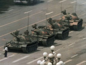 Tiananmen as the democracy movement’s last gasp: The iconic photo of the Tiananmen Square protests, as a Chinese man stands alone to block a line of tanks heading from the Beijing square on June 5, 1989.