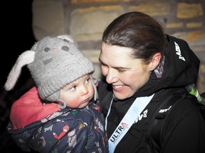 Endurance runner Jasmin Paris (right) holds her daughter Rowan after winning the United Kingdom’s Montane Spine Race on Jan. 16, 2019.