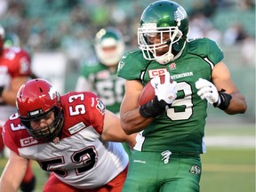 File: Saskatchewan Roughriders wide receiver Nic Demski (#9) makes great yardage on a kickoff return while Calgary Stampeders offensive lineman Brad Erdos (#53) comes up from behind during CFL preseason action at Mosaic Stadium in Regina on June 19, 2015.