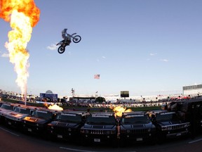 Motorcycle daredevil "Kaptain" Robbie Knievel jumps, 20 Hummer H2 SUVs prior to the IRL IndyCar Series Bombardier Learjet 550k on June 7, 2008 at the Texas Motor Speedway in Fort Worth, Texas.