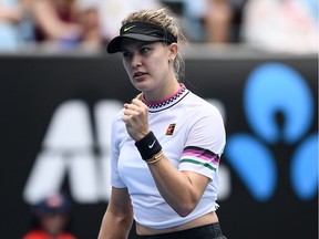Canada's Eugenie Bouchard reacts after a point against China's Peng Shuai during their women's singles match on day two of the Australian Open tennis tournament in Melbourne on January 15, 2019.