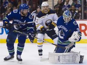 The Vancouver Canucks, aware of the upcoming NHL trade deadline, have some decisions to make, including what to do with veteran Alexander Edler, left, who is playing some of the best defensive hockey of his career.