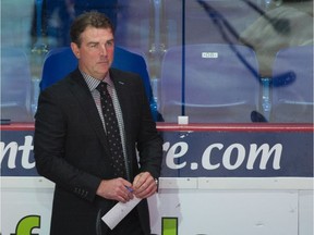 Vancouver Giants associate coach Jamie Heward behind the team's bench during a WHL game earlier this season.