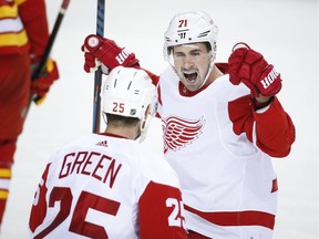 Detroit Red Wings' Dylan Larkin, right, celebrates his goal with teammate Mike Green during the second period against the Calgary Flames Friday. The young squad fell 6-4 despite holding a lead in the third because of costly penalty-kill mistakes.