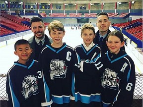 Vancouver Minor Hockey Asssociation's PeeWee A2, "The Spirit" team members from left, assistant captain Isaac, assistant coach Connor, captain Jordan, assistant captain Waylon, coach Stephen Gillis, and assistant captain Paige are seen in this undated handout photo. A Vancouver peewee hockey coach says he's "amazed and overwhelmed" by the response to a video put together by his team to help him find a living kidney donor. Stephen Gillis said the video is the nicest thing that anyone has ever done for him.