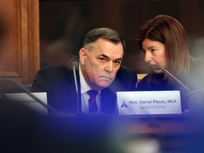 House Speaker Darryl Plecas speaks with Kate Ryan-Lloyd, acting clerk of the house, during a legislative assembly management committee meeting in Victoria on Jan. 21.