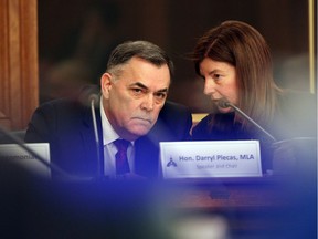 House Speaker Darryl Plecas speaks with Kate Ryan-Lloyd, acting clerk of the House, during a legislative assembly management committee meeting in Victoria on Jan. 21.