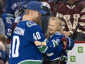 Elias Pettersson of the Vancouver Canucks, who might play Sunday against the visiting Detroit Red Wings, shared a laugh with Blanca Ericksson during the Vancouver Canucks' Super Skills Contest last month at Rogers Arena.