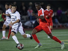 Simon Fraser's Mamadi Camara, right, makes his way past Seattle Pacific's Jordan Kollars during Great Northwest Athletic Conference game last season. He was taken in the MLS SuperDraft by the San Jose Earthquakes with a second-round pick.
