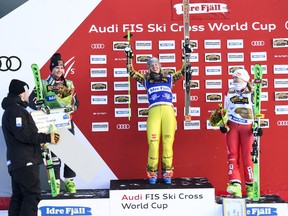 First placed Heidi Zacher of Germany, centre, with second placed Marielle Thompson of Canada, left, with Switzerland's Fanny Smith third place, on the podium after women's final FIS Freestyle Ski Cross World Cup event in Idre, Sweden,  Saturday Jan. 19. 2019.