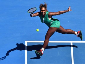 Serena Williams hits a return against Karolina Pliskova during their women's singles quarter-final match on day ten of the Australian Open tennis tournament in Melbourne on Jan. 23, 2019. (PAUL CROCK/AFP/Getty Images)