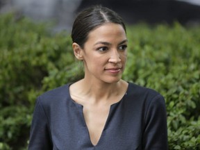 Alexandria Ocasio-Cortez takes a moment between interviews in New York, Wednesday, June 27, 2018.