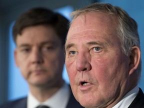 Federal Minister of Border Security and Organized Crime Reduction, Bill Blair speaks as British Columbia Attorney General, David Eby looks on during a news conference in Vancouver, Tuesday, Jan 22, 2019. Minister Blair and Attorney General Eby were speaking about a meeting which they had to try and address concerning money laundering in the province.