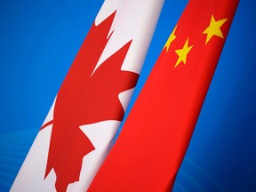 Flags of Canada and China are placed for the first China-Canada economic and financial strategy dialogue in Beijing, China, Monday, Nov. 12, 2018.