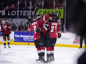 The Vancouver Giants celebrate during their win in Spokane.