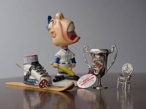 The late Maureen Todd's collection included a "crybaby" baseball bobblehead, a miniature ski and boot, and a miniature Mr. PG chair.