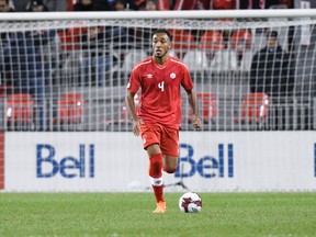 Derek Cornelius brings the ball up field during a during Canada's 5-0 Concacaf Nations League qualifying win over Dominica. The centreback signed a multi-year deal with the Vancouver Whitecaps this week. 

Derek Cornelius
Bell Canada advertising sponsor board