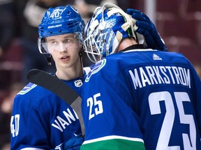 Vancouver Canucks' Elias Pettersson, left, and goalie Jacob Markstrom, both of Sweden, celebrate Vancouver's 5-1 winning NHL hockey game against the Philadelphia Flyers, in Vancouver on Dec. 15, 2018. This weekend, Pettersson will live out a whole new dream, taking part in the league's All-Star weekend.