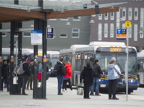 Buses and riders at the UBC bus exchange.
