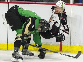 Vancouver Giants' Yannik Valenti is upended by Prince Albert Raiders' Kaiden Guile in the team's meeting earlier this season at the Langley Events Centre.