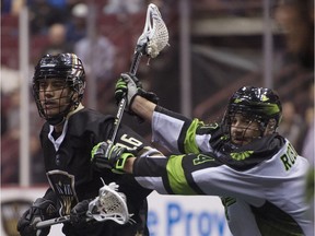 Vancouver Warriors forward Mitch Jones is pushed by Saskatchewan Rush defender Kyle Rubisch in a 2019 NLL game. Such match-ups could be seen by TSN's audiences this coming NLL season.
