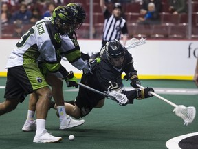 Vancouver Warrior Jordan McBride gets hit as he comes in at the net against Saskatchewan last weekend.