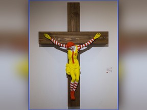 An artwork called "McJesus," which was sculpted by Finnish artist Jani Leinonen and depicts a crucified Ronald McDonald, is seen on display as part of the Haifa museum's "Sacred Goods" exhibit, in Haifa, Israel, Monday, Jan. 14, 2019.